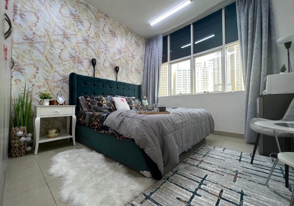 Al Majaz House | Park view bedroom in family apartment