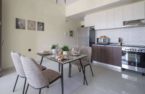 Dubai Apartment | Impressive 1BR with Pool Views in Liwan!