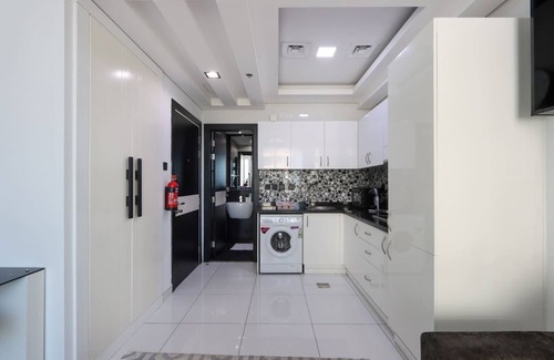 Dubai Sports City Apartment | Livbnb-Sleek Modern Studio with Balcony, Dubai Sports City