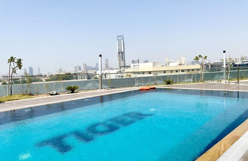Jumeirah Village Triangle Apartment | Marco Polo - Pastel Studio with Stunning Aerial City Views