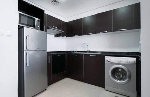 Dubai Sports City Apartment | StoneTree - The Matrix Studio Apartment in Sports City