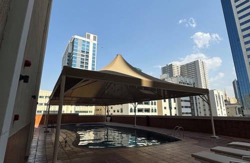 Al Majaz Apartment | Cozy 2-bedroom apartment in superb Sharjah corniche with WiFi, fitness room pool