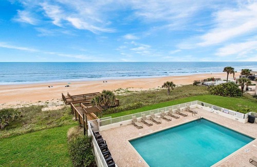 Seawinds Condo Condo | Direct oceanfront 2/2 condo with a private balcony, heated beachfront pool, and garage