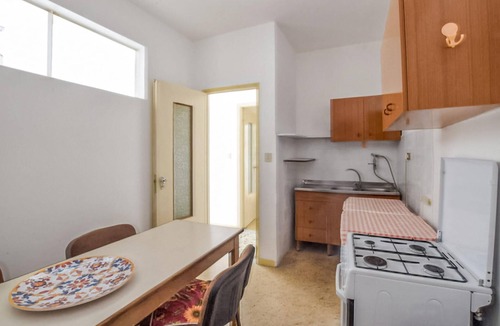 Bianco Apartment | Enjoy sunny days by the crystal-clear sea in this apartment just a few steps from the beach.