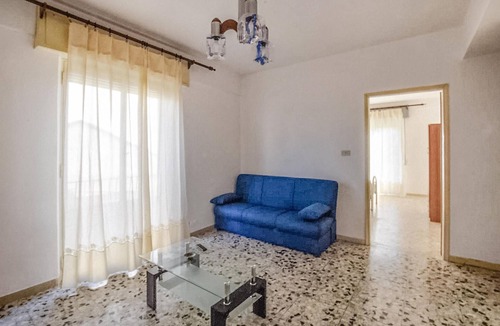 Bianco Apartment | Enjoy sunny days by the crystal-clear sea in this apartment just a few steps from the beach.