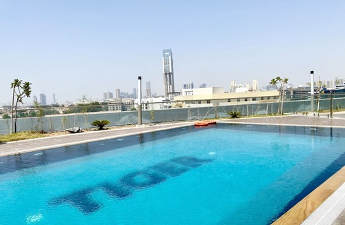 Jumeirah Village Triangle Apartment | Marco Polo - Pastel Studio with Stunning Aerial City Views