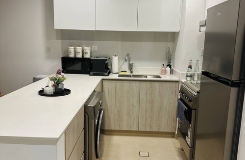 Sharjah Apartment | Modern sanctuary with pool and gym access in downtown aljada
