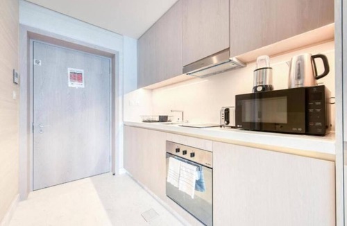 Deira Apartment | Paradise Sea View Studio with St Regis Amenities