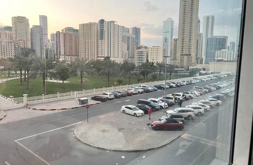 Al Majaz House | Park view bedroom in family apartment