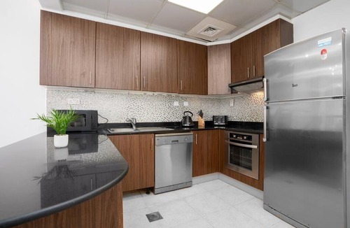 Umm Suqeim 3 Apartment | PoshBeds - Blue light over Marina