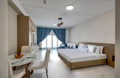 Dubai Investment Park Hotel | Studio Apartment Near Dunes Village Dip By Luxury Bookings