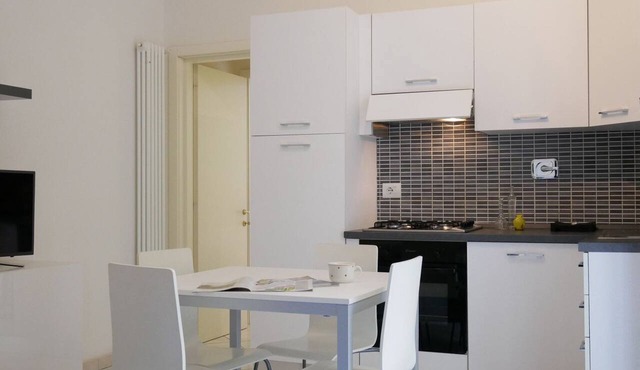 GuestHost - Delightful and brilliant apartment, well equipped and furnished, in a typical Bolognese style building on the first floor with a terrace overlooking the internal courtyard. At night you can enjoy great tranquility.The apartment is located in