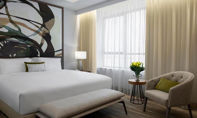 Jadaf Apartment | King Bedroom Near Spring Green Supermarket By Luxury Bookings