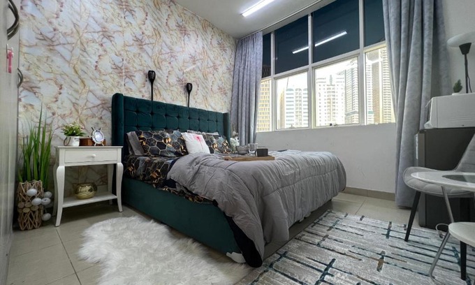 Al Majaz House | Park view bedroom in family apartment